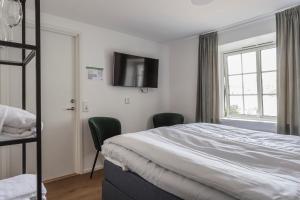 Postel nebo postele na pokoji v ubytování Hotell MAVI