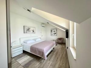 Postel nebo postele na pokoji v ubytování Apartman Mala plaža 2