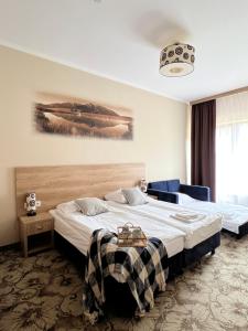 Posteľ alebo postele v izbe v ubytovaní Hotel Nosal Ski & Wine