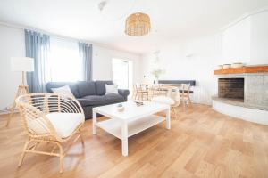 a living room with a couch and a table at Casa A Bicuda in Ferrol
