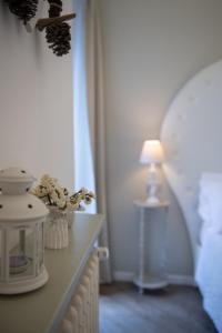 a lamp sitting on a counter with a table at BeB San Lorenzo in Bergamo