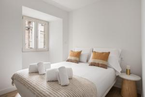 Кровать или кровати в номере Bow Monumental by Como en Casa