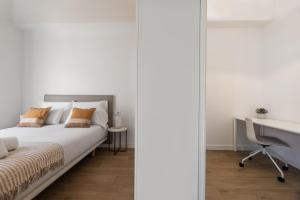 Кровать или кровати в номере Bow Monumental by Como en Casa