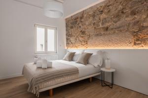 Кровать или кровати в номере Bow Monumental by Como en Casa