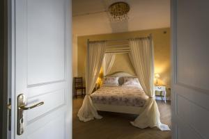 A bed or beds in a room at Pane Amore e Marmellata