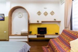 a bedroom with a bed and a desk with a tv at BIG GROUP-ENTIRE HOUSE✩PRIVATE-CENTER-OLD QUARTER in Hanoi
