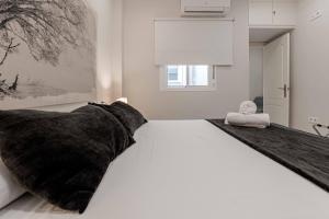 Posteľ alebo postele v izbe v ubytovaní Apartamentos Recaredo 7 , 2ª planta
