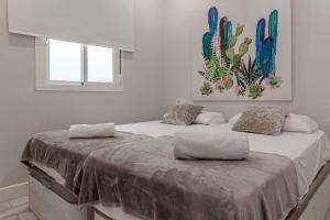 Posteľ alebo postele v izbe v ubytovaní Apartamentos Recaredo 7 , 2ª planta