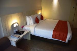 Postel nebo postele na pokoji v ubytování Hotel Citrus Prime Candolm, Goa
