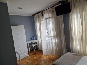 Postel nebo postele na pokoji v ubytování Hostal Fidalgo