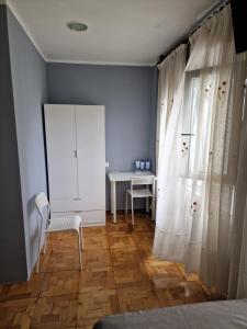 Postel nebo postele na pokoji v ubytování Hostal Fidalgo