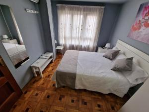 Postel nebo postele na pokoji v ubytování Hostal Fidalgo