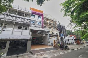 a building that is under construction on a street at Aranis Hotel in Jakarta