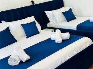Postel nebo postele na pokoji v ubytování ILLYRIAN hotel Ksamil