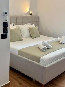 Postel nebo postele na pokoji v ubytování ILLYRIAN hotel Ksamil