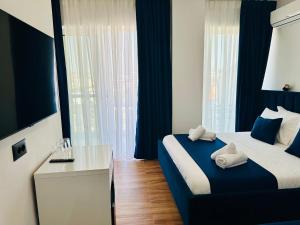 Postel nebo postele na pokoji v ubytování ILLYRIAN hotel Ksamil