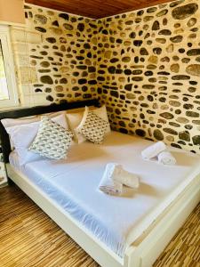 Postel nebo postele na pokoji v ubytování ILLYRIAN hotel Ksamil