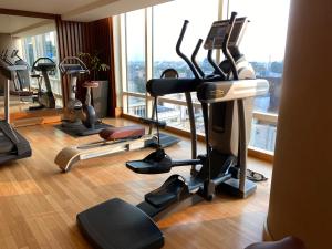 a gym with cardio equipment in a hotel room at The Ritz - Carlton, Bangalore in Bangalore