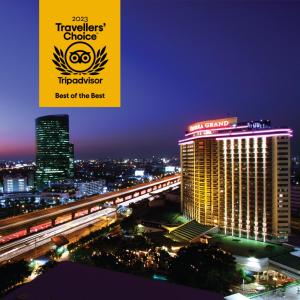 a view of the tivoli towers hotel at night at Centara Grand at Central Plaza Ladprao Bangkok in Bangkok