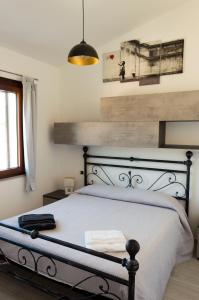 Postel nebo postele na pokoji v ubytování Is Seddas B&B