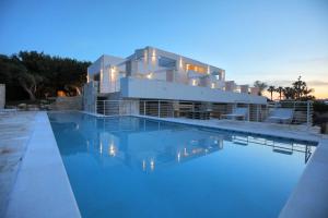 a villa with a swimming pool at dusk at MEDITERRANEO RELAX in Polignano a Mare +38 photos