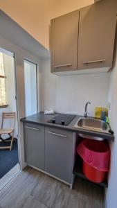a small kitchen with a sink and a counter at PARIS in Ljubljana