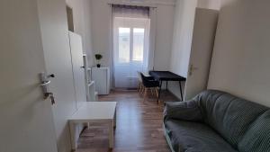 a living room with a couch and a table at PARIS in Ljubljana