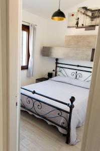 Postel nebo postele na pokoji v ubytování Is Seddas B&B