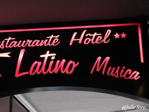 a neon sign for a latrine hotel lifting museum at Hôtel Latino Reims Centre in Reims