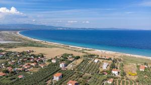 an aerial view of a beach and the ocean at Chryssis Village by Travel Pro Services - Nea Potidaia Halkidiki in Nea Potidaea