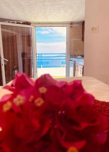 a room with a bed with a view of the ocean at Apartamento Atlantico in Santa Cruz de Tenerife