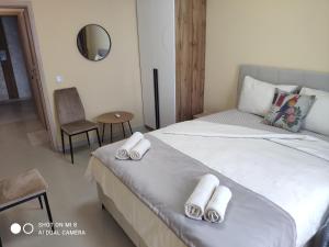a bedroom with a bed with towels on it at Dolce Vita Residenza in Nesebar +52 photos