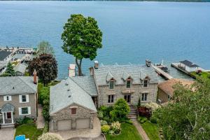 an aerial view of a house on the water at Riverside Retreat in Brockville