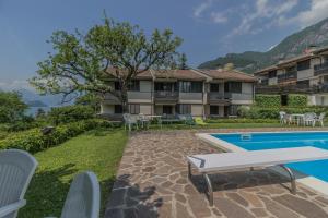 a villa with a swimming pool and a resort at Blu al Lago in Lierna