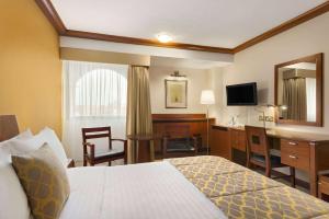 TV a/nebo společenská místnost v ubytování Ramada by Wyndham Bahrain