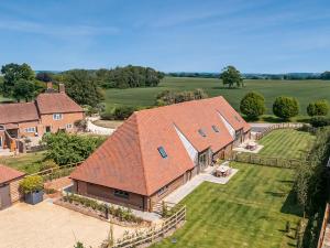 an aerial view of a large house with a yard at Hatchers Barn - Uk42080 in East Garston