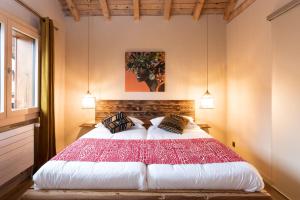 A bed or beds in a room at Le Wafo
