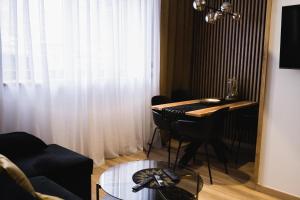 Televízia a/alebo spoločenská miestnosť v ubytovaní Apartament 88