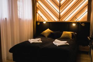 Posteľ alebo postele v izbe v ubytovaní Apartament 88