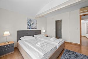Postel nebo postele na pokoji v ubytování Minerva Hotel
