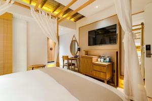 Yoba Boutique Hotel客房内的一张或多张床位