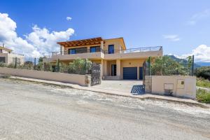 a house on the side of a road at Villa Lurenzu - Maison pour 8 avec piscine in Belgodère