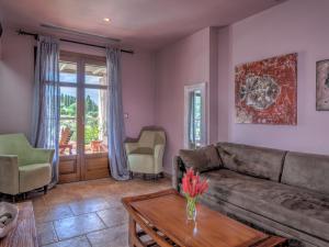 a living room with a couch and a table at Fiscardo Bay Hotel in Fiskardo