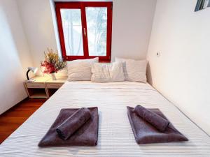 En eller flere senge i et værelse på Robinson Ina 3