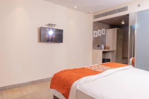 Postel nebo postele na pokoji v ubytování Hotel Citrus Prime Candolm, Goa