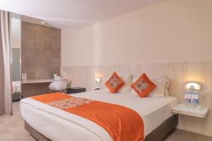 Postel nebo postele na pokoji v ubytování Hotel Citrus Prime Candolm, Goa