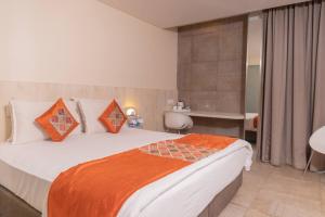 Postel nebo postele na pokoji v ubytování Hotel Citrus Prime Candolm, Goa