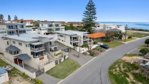an aerial view of a house with the ocean in the background at The Haven on Blue Bay in Mandurah