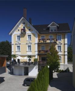 a small house with a large window at Ebner - Boutique-Hotel & Konditorei in Lindau