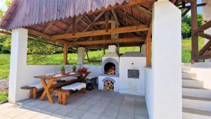a patio with a wood fired pizza oven at Chata Holý Vrch - oáza kľudu a pokoja in Krupina